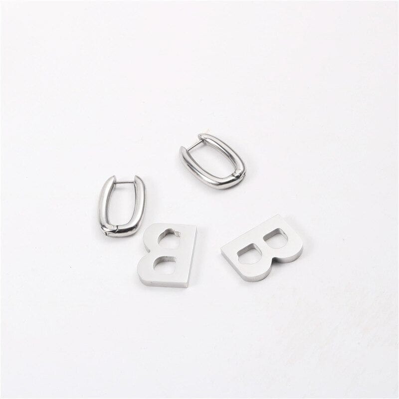 melomelo Silver B Logo Earrings